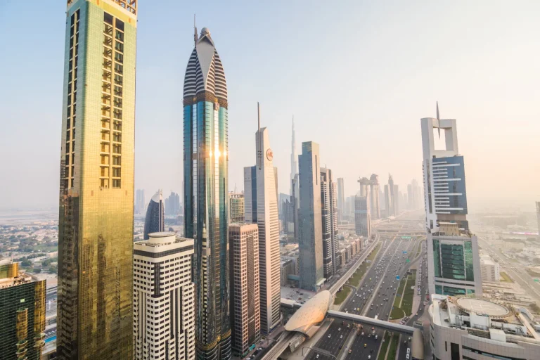 Dubai skyline of towers along Sheikh Zayed Road in hazy morning light